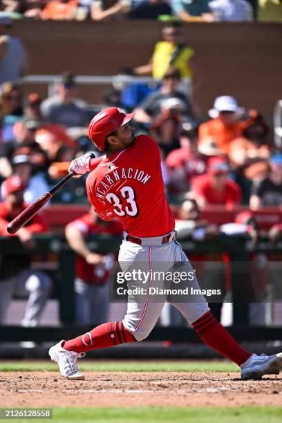 Christian Encarnacion-Strand of the Cincinnati Reds hits a two-run home run during the fourth inning of a spring training game against the San...