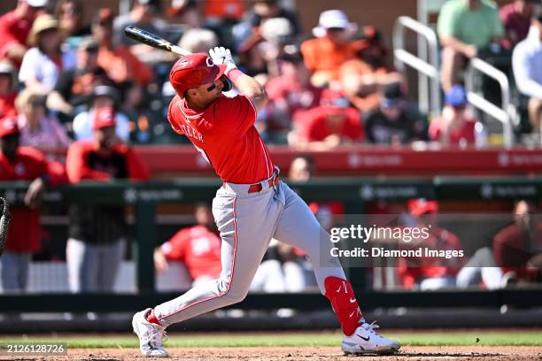 Spencer Steer of the Cincinnati Reds hits a single during the fourth inning of a spring training game against the San Francisco Giants at Scottsdale...