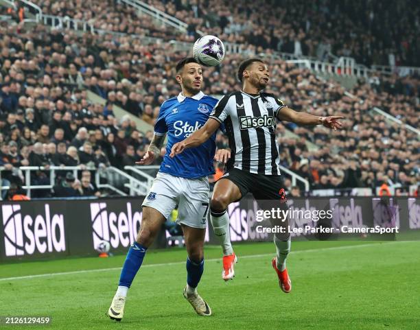 Newcastle United's Jacob Murphy tries to control the ball under pressure from Everton's Dwight McNeil during the Premier League match between...