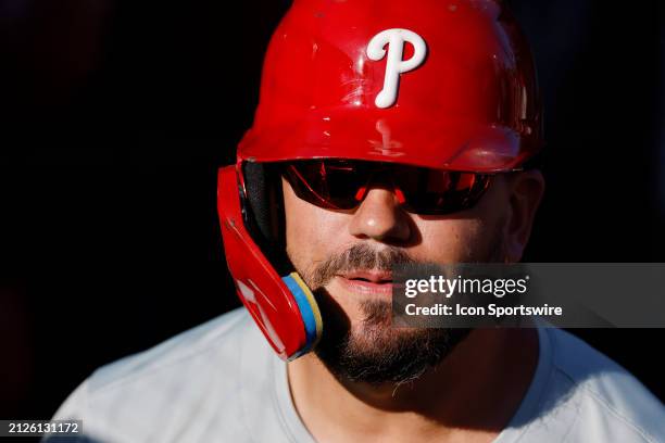 Philadelphia Phillies designated hitter Kyle Schwarber looks on in the dugout during an MLB spring training game against the Baltimore Orioles on...