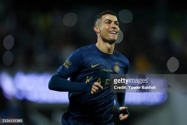 Cristiano Ronaldo of Al Nassr celebrates after scoring the 4th goal during the Saudi Pro League match between Abha Club and Al-Nassr at Prince Sultan...