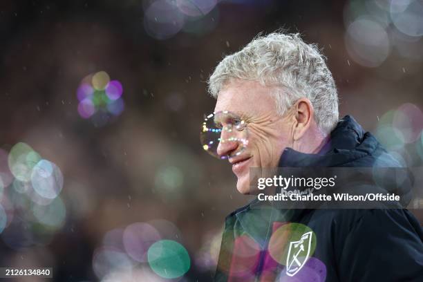 Bubble floats past West Ham manager David Moyes during the Premier League match between West Ham United and Tottenham Hotspur at London Stadium on...