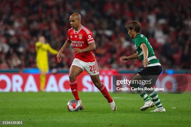 Joao Mario of SL Benfica tries to escape Hidemasa Morita of Sporting CP during the match between SL Benfica and Sporting CP for Semi-Final second Leg...