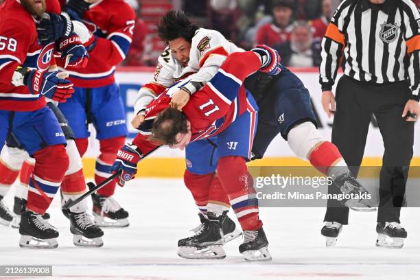 Brandon Montour of the Florida Panthers jumps onto Brendan Gallagher of the Montreal Canadiens during the third period at the Bell Centre on April 2,...