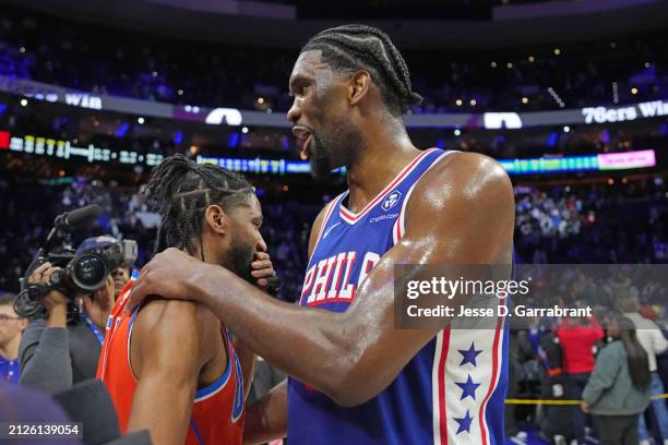 Isaiah Joe of the Oklahoma City Thunder greets Joel Embiid of the Philadelphia 76ers after the game on April 2, 2024 at the Wells Fargo Center in...