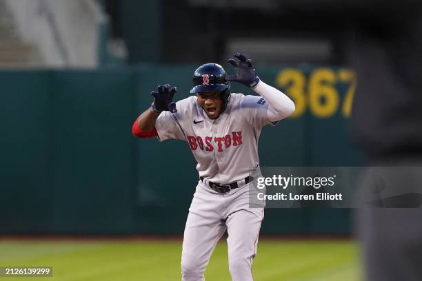 Pablo Reyes of the Boston Red Sox celebrates an RBI double during the third inning against the Oakland Athletics at Oakland Coliseum on April 02,...