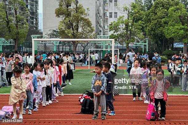 Students evacuate to the playground at a school in Xiamen, in eastern China's Fujian province on April 3 after a major earthquake hit Taiwan's east....