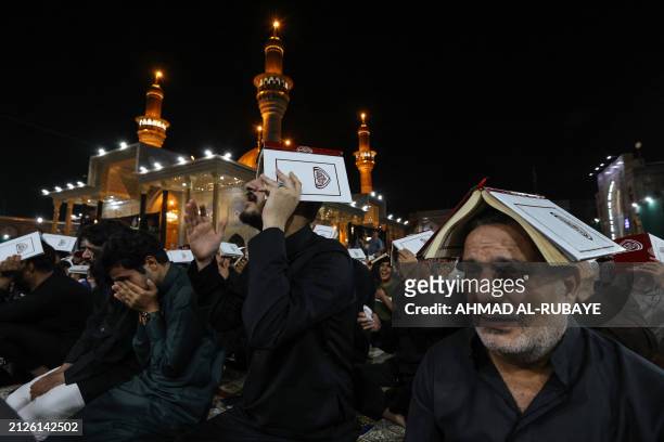 Muslim worshippers perform prayer rituals on Laylat al-Qadr , one of the holiest nights during Islam's holy fasting month of Ramadan, at the shrine...