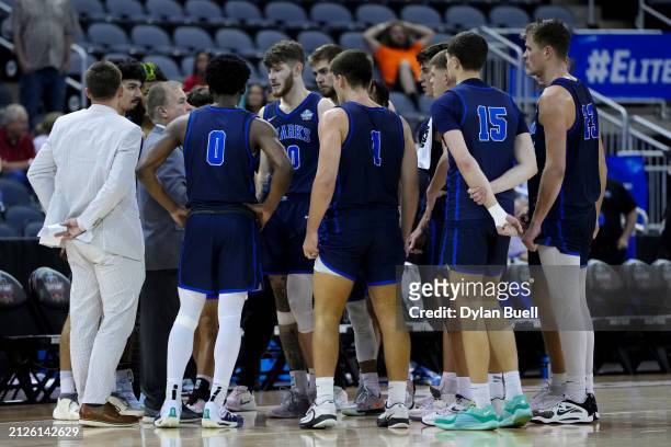 The Nova Southeastern Sharks huddle during a timeout in the second half against the Minnesota State Mavericks during the NCAA Division II Men's...