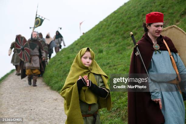 Participants are entering onto the mound during the traditional Rekawka festival at the Krakus Mound in Krakow, Poland, on April 2, 2024. The 23rd...