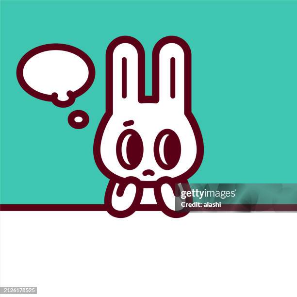 a cute bunny sitting at the table with a sad expression, hands on the chin, head leaning on hand, looking to the right side - chin stock illustrations