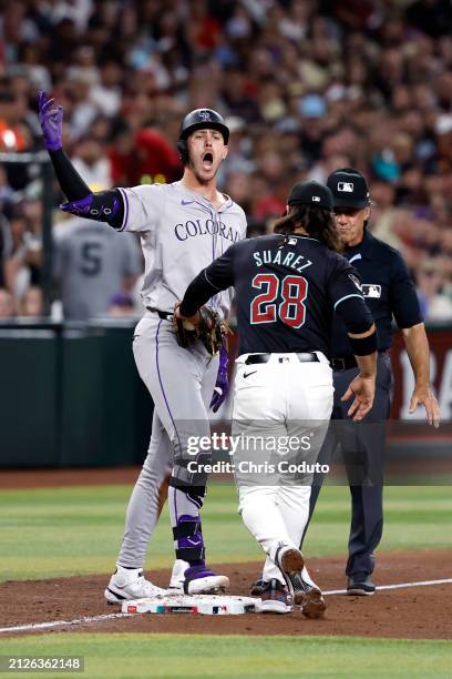 Nolan Jones of the Colorado Rockies reacts after hitting a two RBI triple during the fifth inning against the Arizona Diamondbacks at Chase Field on...