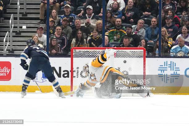 Damon Severson of the Columbus Blue Jackets scores a goal on Alex Nedeljkovic of the Pittsburgh Penguins during a shootout at Nationwide Arena on...