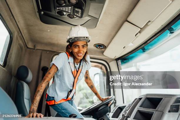 portrait of a female truck driver - transportation truck stock pictures, royalty-free photos & images