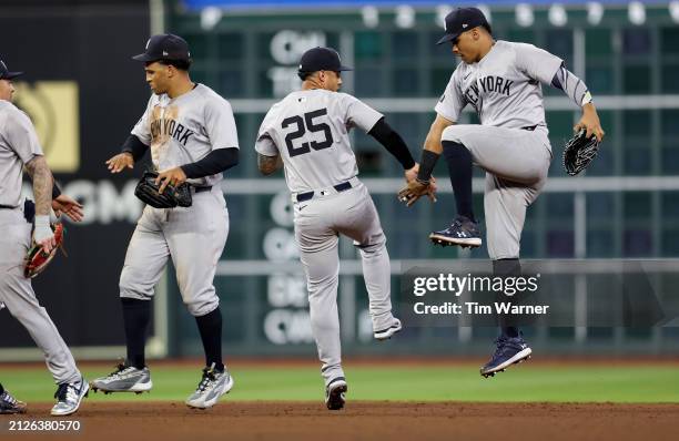 Gleyber Torres of the New York Yankees and Juan Soto celebrate after defeating the Houston Astros at Minute Maid Park on March 30, 2024 in Houston,...