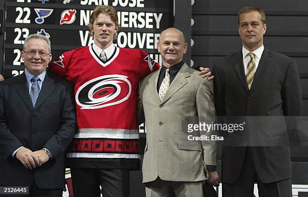 Jim Rutherford, CEO and General Manager, Eric Staal, Sheldon Ferguson, Scout, and Paul Maurice of the Carolin Hurricanes pose for a portrait on stage...