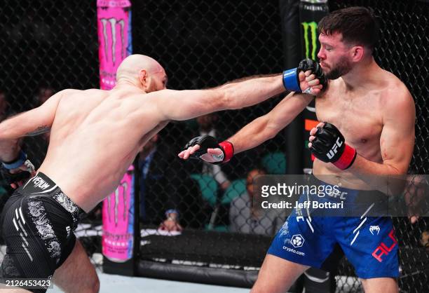 Kyle Nelson of Canada punches Bill Algeo in a featherweight bout during the UFC Fight Night event at Boardwalk Hall Arena on March 30, 2024 in...