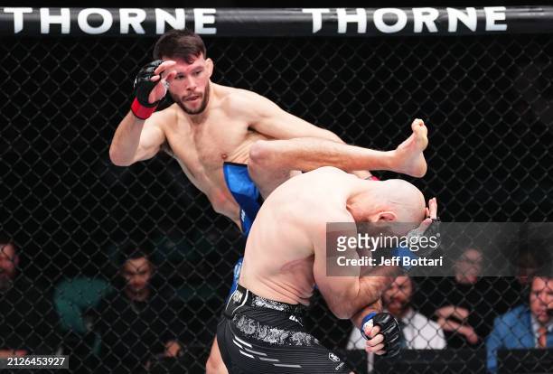 Bill Algeo kicks Kyle Nelson of Canada in a featherweight bout during the UFC Fight Night event at Boardwalk Hall Arena on March 30, 2024 in Atlantic...