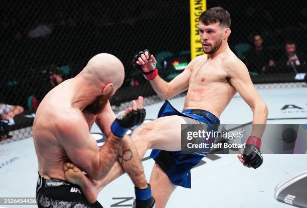 Bill Algeo kicks Kyle Nelson of Canada in a featherweight bout during the UFC Fight Night event at Boardwalk Hall Arena on March 30, 2024 in Atlantic...