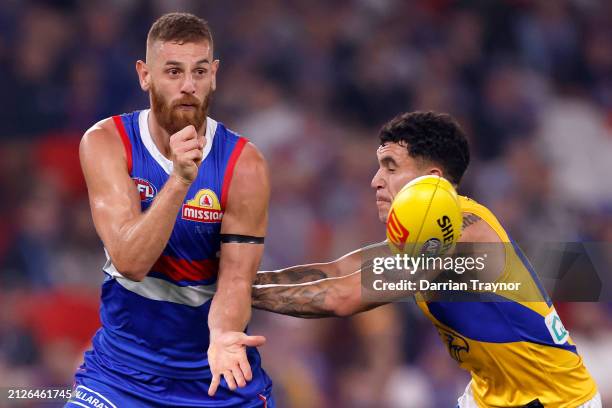 Liam Jones of the Bulldogs handballs during the round three AFL match between Western Bulldogs and West Coast Eagles at Marvel Stadium, on March 31...