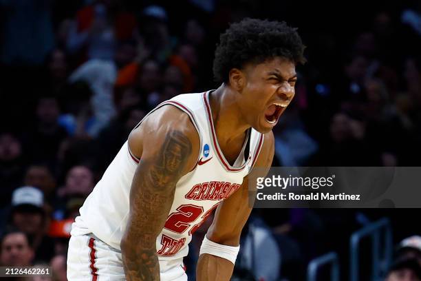Nick Pringle of the Alabama Crimson Tide celebrates after a three point basket during the second half against the Clemson Tigers in the Elite 8 round...