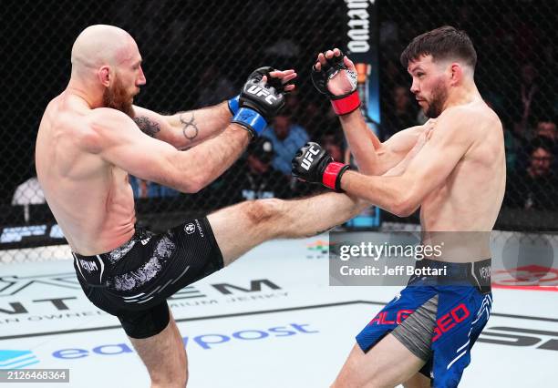 Kyle Nelson of Canada kicks Bill Algeo in a featherweight bout during the UFC Fight Night event at Boardwalk Hall Arena on March 30, 2024 in Atlantic...