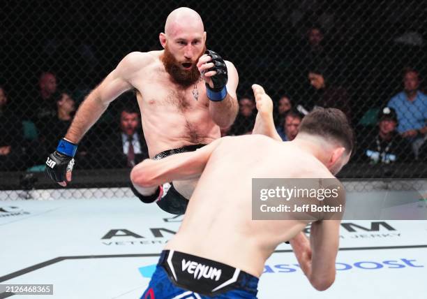 Kyle Nelson of Canada kicks Bill Algeo in a featherweight bout during the UFC Fight Night event at Boardwalk Hall Arena on March 30, 2024 in Atlantic...