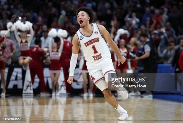 Mark Sears of the Alabama Crimson Tide celebrates defeating the Clemson Tigers 89-82 in the Elite 8 round of the NCAA Men's Basketball Tournament at...
