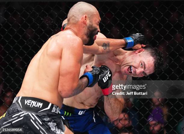 Chris Weidman punches Bruno Silva of Brazil in a middleweight bout during the UFC Fight Night event at Boardwalk Hall Arena on March 30, 2024 in...