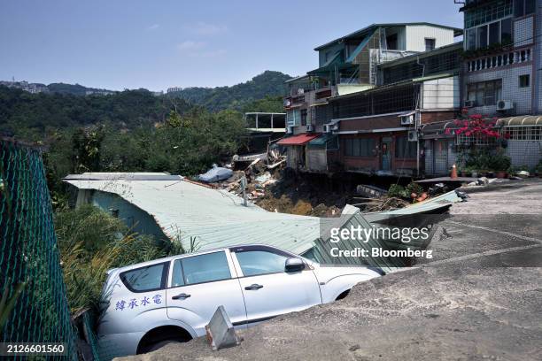 Vehicle in a collapsed road following an earthquake in New Taipei City, Taiwan, on Wednesday, April 3, 2024. Taiwan has been hit by the strongest...