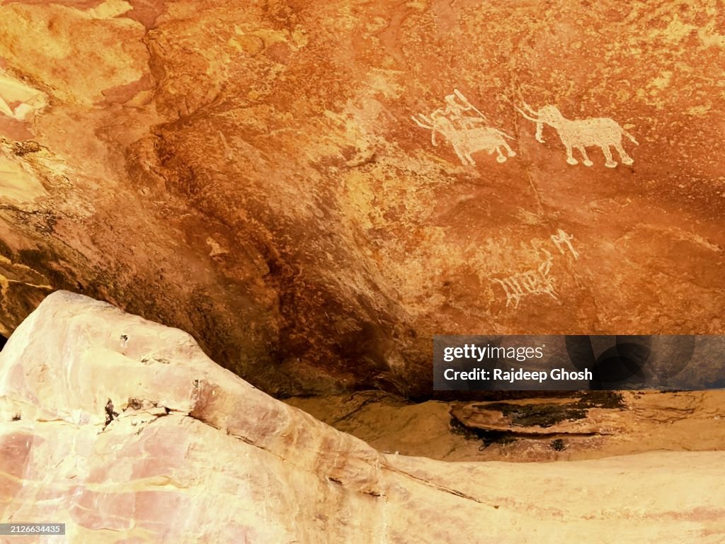 Ancient war art on stone cave walls
