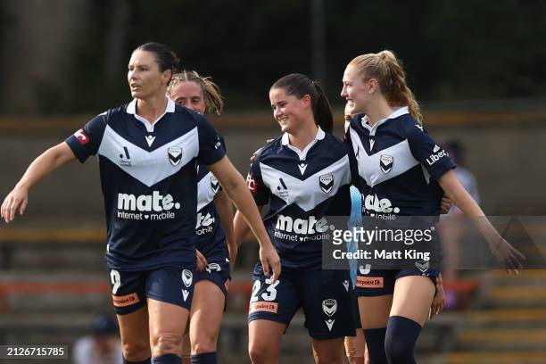 Rachel Lowe of the Victory celebrates with team mates after scoring a goal during the A-League Women round 22 match between Sydney FC and Melbourne...
