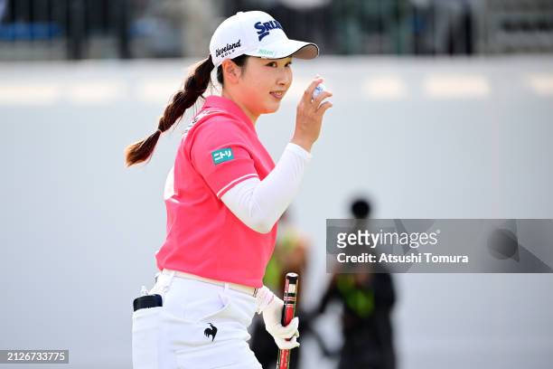 Sakura Koiwai of Japan acknowledges the gallery after holing out with the birdie on the 18th green during the final round of YAMAHA Ladies Open...