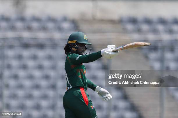 Nigar Sultana of Bangladesh acknowledges the applause of team mates after scoring a fifty during game one of the Women's T20 International series...