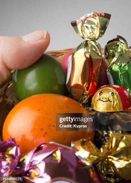 easter basket with eggs and candy - hard boiled candy stock pictures, royalty-free photos & images