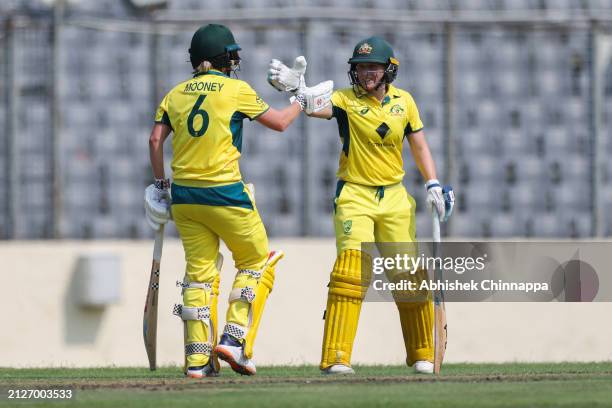 Beth Mooney of Australia is congratulated by team mate Alyssa Healy after scoring a fifty during game one of the Women's T20 International series...