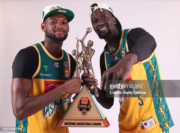 Milton Doyle of the JackJumpers and Majok Deng of the JackJumpers pose with the Championship Trophy after winning during game five of the NBL...