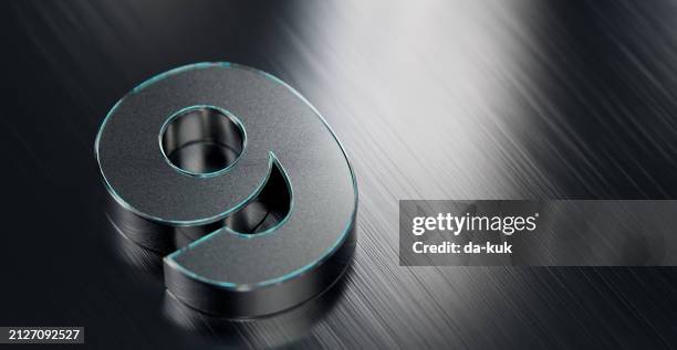 metallic number nine on reflective stainless steel background - numerology stock pictures, royalty-free photos & images