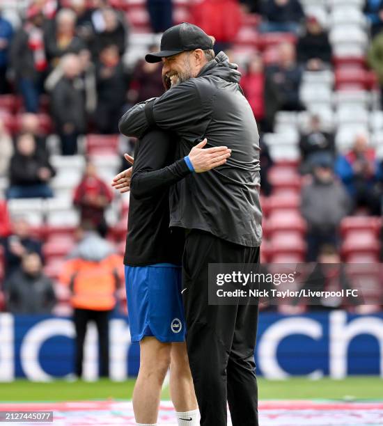 Manager Jurgen Klopp of Liverpool and Adam Lallana of Brighton & Hove Albion during the Premier League match between Liverpool FC and Brighton & Hove...