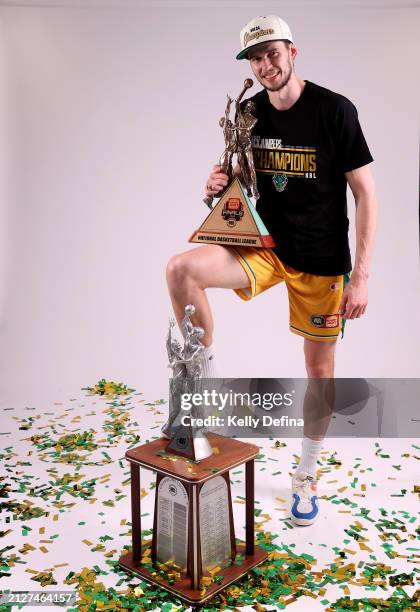Clint Steindl of the JackJumpers pose with the Championship Trophy after winning game five of the NBL Championship Grand Final Series between...