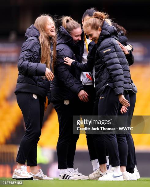 Chelsea players inspect the pitch ahead of the FA Women's Continental Tyres League Cup Final match between Arsenal and Chelsea at Molineux on March...