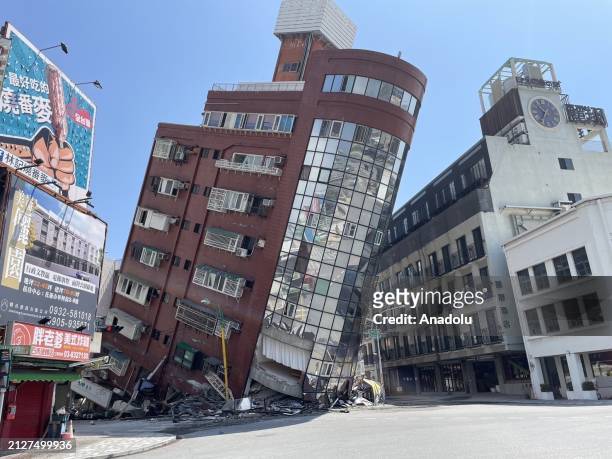 The Uranus Building at Xuanyuan Road is tilted severely as at least four people were killed and hundreds of others injured after a magnitude 7.4...