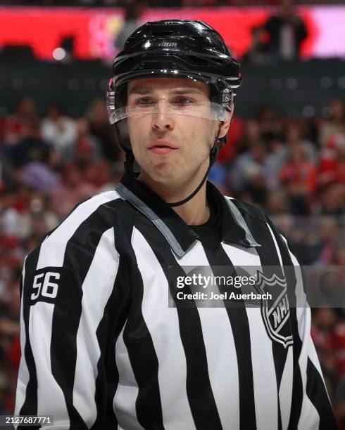 Linesman Julien Fournier looks on during a break in action between the Florida Panthers and the Detroit Red Wings at the Amerant Bank Arena on March...