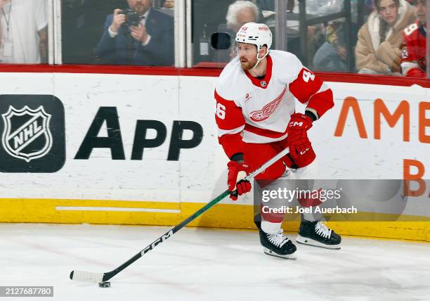 Jeff Petry of the Detroit Red Wings clears the puck against the Florida Panthers at the Amerant Bank Arena on March 30, 2024 in Sunrise, Florida.