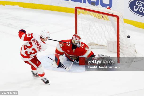 Goaltender Sergei Bobrovsky of the Florida Panthers stops a shot by Lucas Raymond of the Detroit Red Wings during the shoot out at the Amerant Bank...