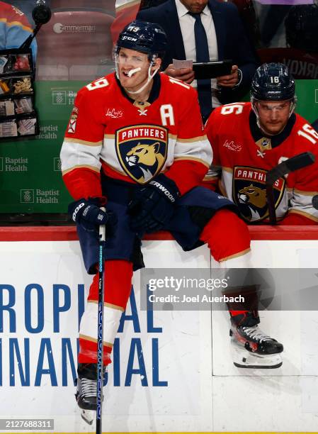 Matthew Tkachuk of the Florida Panthers sits on the boards during a break in action against the Detroit Red Wings at the Amerant Bank Arena on March...
