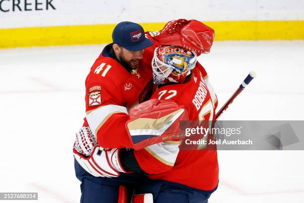 Goaltender Anthony Stolarz congratulates goaltender Sergei Bobrovsky of the Florida Panthers after the shoot out win against the Detroit Red Wings at...