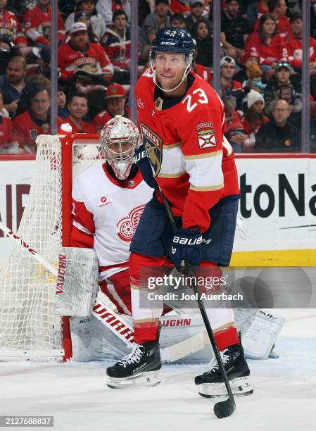 Carter Verhaeghe of the Florida Panthers waits for a pass in front of goaltender Alex Lyon of the Detroit Red Wings at the Amerant Bank Arena on...