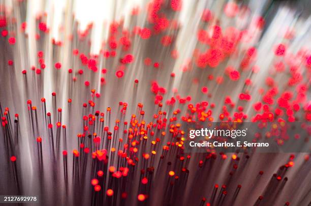 fiber optic tubes illuminated with red tips. - yonkers stock pictures, royalty-free photos & images