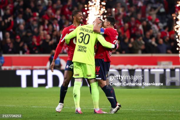 Benjamin Andre of Lille OSC celebrates with Lucas Chevalier of Lille OSC and Alexsandro Victor De Souza Ribeiro of Lille OSC the victory of the Ligue...